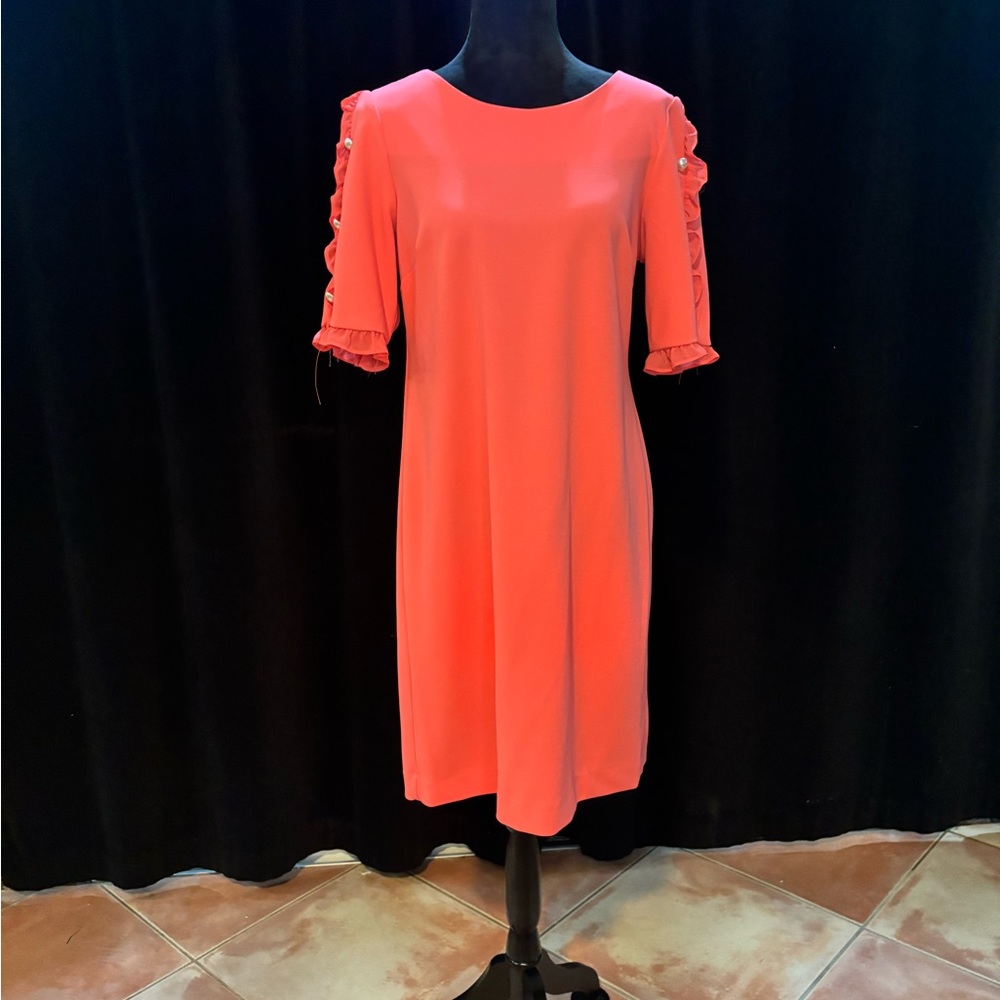 Coral ruffle sleeve dress with pearl accents